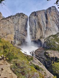 Upper yosemite falls in the spring with lingering winter snow at yosemite national park