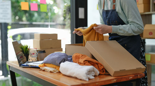 Midsection of man working at home