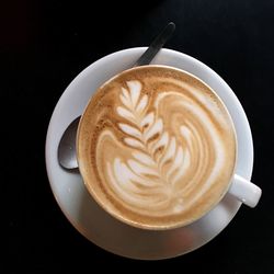 Close-up of cappuccino on table