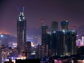 Illuminated buildings in city at night