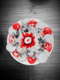 Close-up of red flowers on table