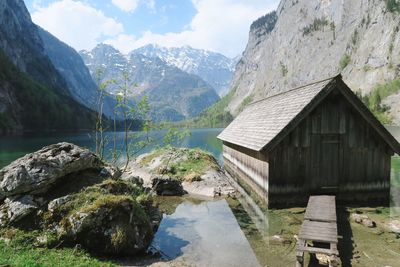 Scenic view of houses and mountains against sky