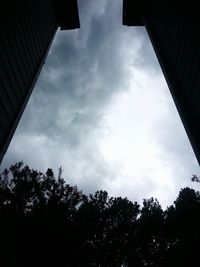Low angle view of building against cloudy sky