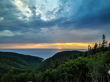 Scenic view of landscape against cloudy sky