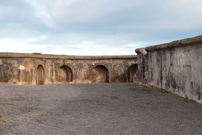 Arch wall against sky