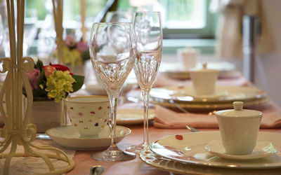 Close-up of wineglasses on table