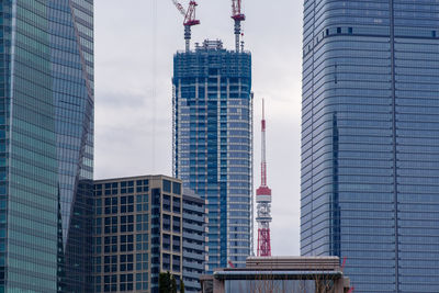 Low angle view of skyscrapers against sky