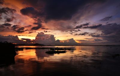 View of dramatic sky over sea during sunset