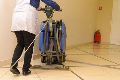 Floor care and cleaning services with washing machine in shopping and entertainment center.