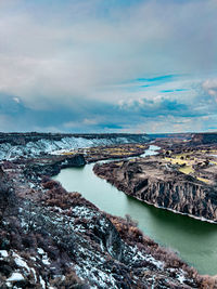Scenic view of river canyon against sky