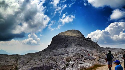 Scenic view of mountains against cloudy sky