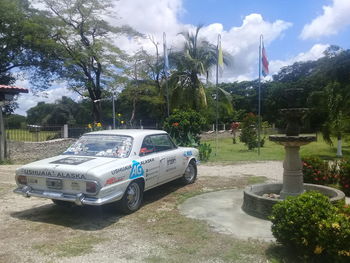 View of cars on road against sky