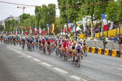 People riding bicycles on street