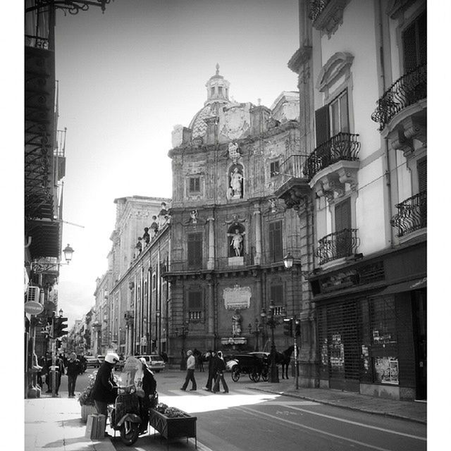 architecture, building exterior, built structure, men, street, person, city, large group of people, walking, city life, lifestyles, transfer print, car, transportation, road, group of people, city street, land vehicle, auto post production filter