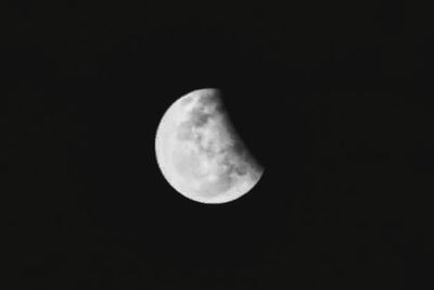 Low angle view of moon against sky at night