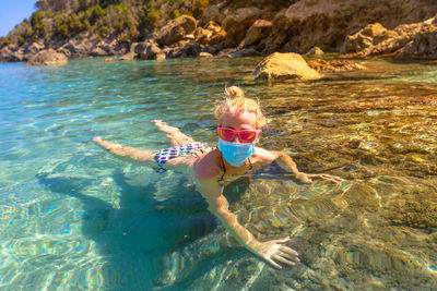 Woman swimming in sea