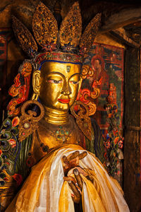 Buddha statue in temple outside building