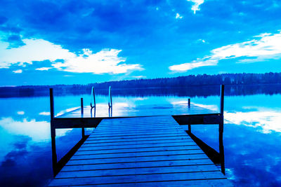 Empty pier over calm lake