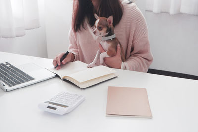 Woman using laptop on table