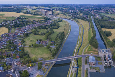 High angle view of river amidst buildings in city