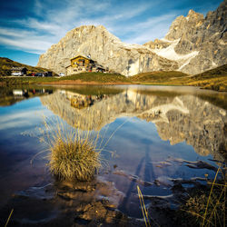 Scenic view of lake and mountains against sky