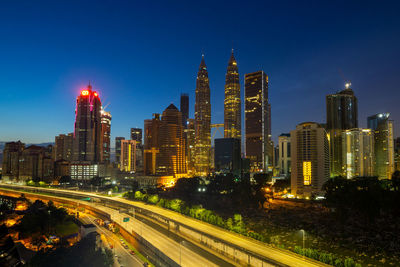 Illuminated buildings in city at night