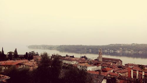 High angle view of river by town against sky