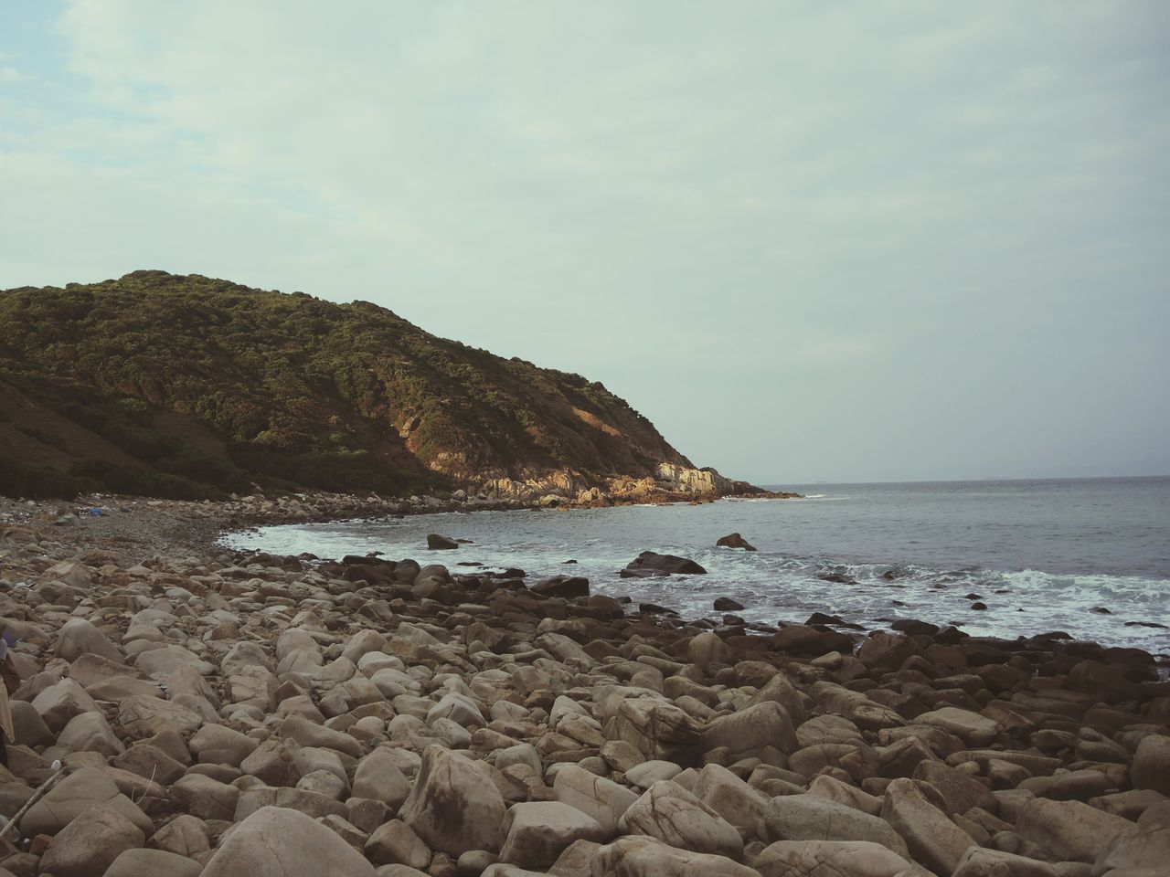 sea, water, sky, horizon over water, scenics, tranquil scene, beach, rock - object, tranquility, shore, beauty in nature, nature, rock formation, cloud - sky, idyllic, rock, stone - object, coastline, remote, calm