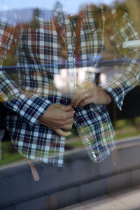 Close-up of hand on blouse 