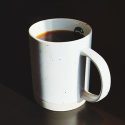 Close-up of coffee cup on table