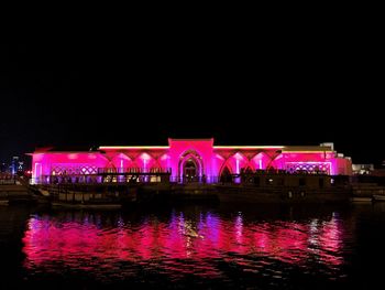 Reflection of illuminated buildings in water