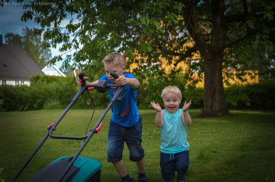 Full length of boy playing on grass