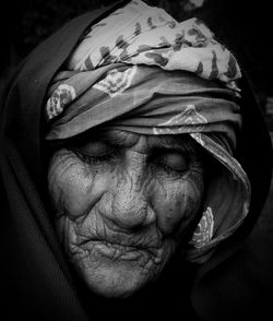 Close-up portrait of old  woman  wearing shawland headgear, india