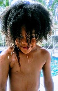Portrait of shirtless boy in swimming pool