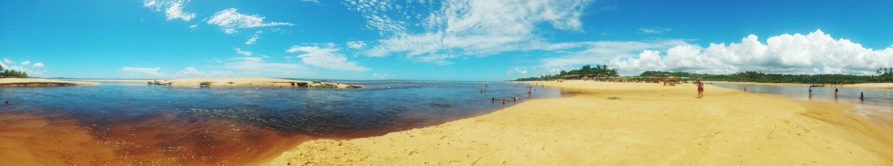 Panoramic view of beach against blue sky