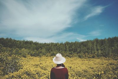 Silhouette of woman standing on field