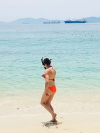 Woman walking at beach