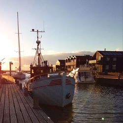 Boats moored at harbor