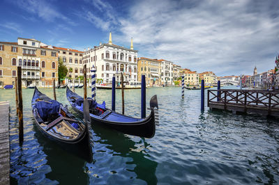 Boat moored in canal, ponte di rialto