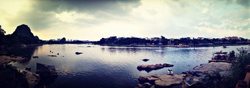 Scenic view of sea against cloudy sky