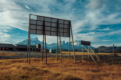 Built structure on field against sky