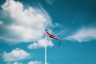 Low angle view of flag against sky