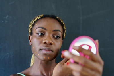 Close-up portrait of a serious young woman