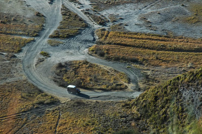 High angle view of road amidst trees