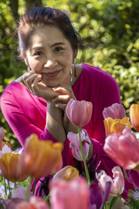 Portrait of woman with pink flowers