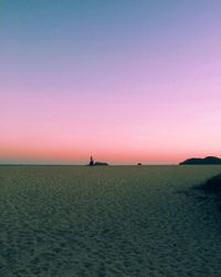 Scenic view of sea against clear sky at sunset