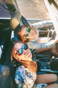 High angle portrait of friends traveling in car