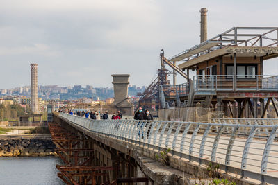 View of bridge in city against sky