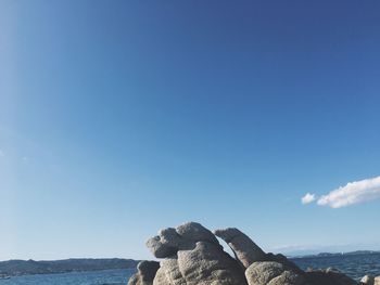 Scenic view of sea against blue sky