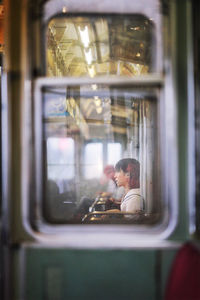 Reflection of train on glass window